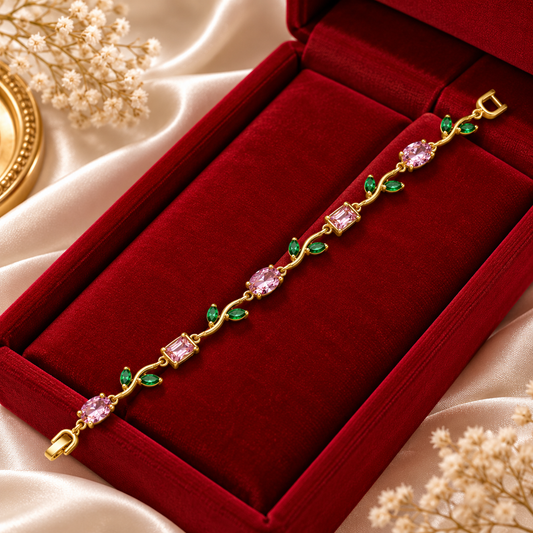 Elegant Gold Bracelet with Pink Gemstones and Green Leaf Accents